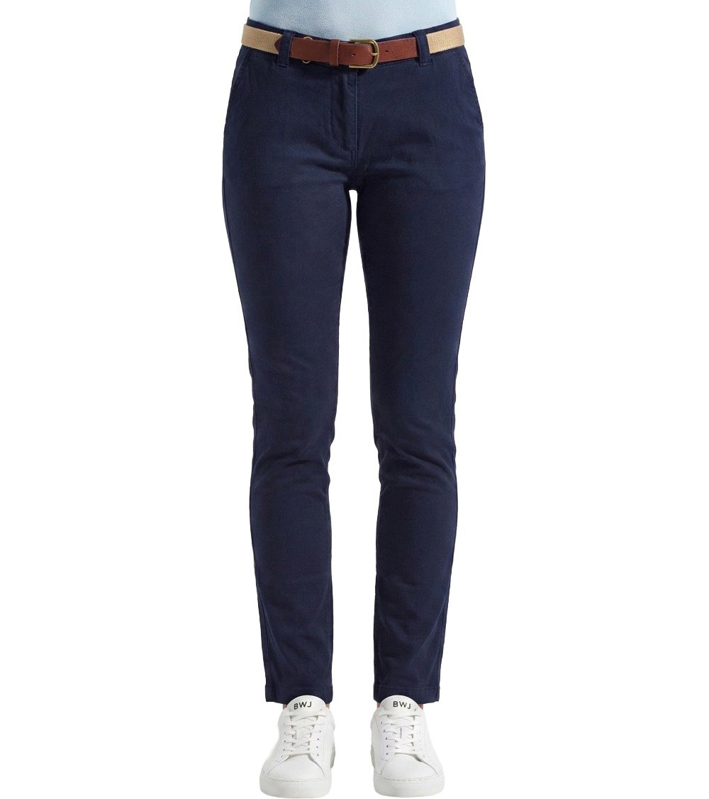 Front view of Black White Jeans Women's Classic Fit Navy Chinos, showing the waistband, belt loops, front pockets, and zip fly. Model is standing straight in white BWJ sneakers.