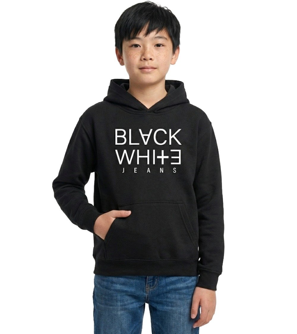 Young boy with freckles wearing black kid's pullover hoodie with white BLACK WHITE JEANS logo and blue jeans, hand in kangaroo pocket.