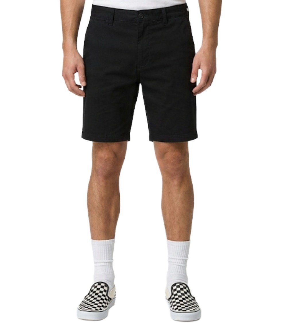 Men's Core Chino Shorts in Black - Front view. Model wearing black smart-casual shorts styled with Vans Checkerboard Slip-On trainers. 100% Cotton Twill urban streetwear.